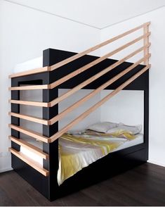 a bunk bed with wooden slats on the top and bottom, in a bedroom