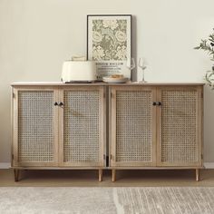 a sideboard with wicker doors in a living room