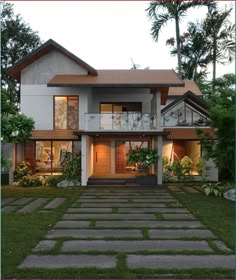 a large house that is in the middle of some grass and plants on the front lawn