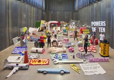 a table topped with lots of assorted toys and paper cutouts on top of it