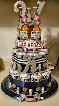 a cake made to look like a las vegas sign and two bottles of liquor on top