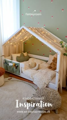 a child's bed with lights on the ceiling