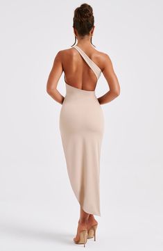 Effortlessly elegant and sexy all at once, say hello to your must-have of the season. The premium stretch crepe fabric is super stretchy for comfort and snatches the figure, complete with a shaped hem, asymmetric back strap detail and one shoulder. 



Colour: Nude.

Premium stretch crepe fabric.

Fully lined.

Moulds to the body figure.

One shoulder.

Asymmetric back strap detail.

Shaped hem.

Thigh high split.

Invisible zipper.

Midi length.

Model is an XS and is wearing an XS.

 Size: XS, Elegant Backless Bodycon Dress For Spring, Sleek Bodycon Backless Dress, Sleek Stretch Backless Dress, Flattering Elastane Midi Dress For Night Out, Fitted Backless Midi Dress For Dinner, Stretch Maxi Length Bodycon Cocktail Dress, Fitted Elastane Midi Dress For Date Night, Chic Stretch Bodycon Dress For Dinner, Chic Smoothing Bodycon Dress