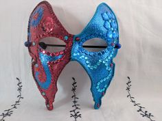 A unique hand-painted & hand-decorated carnival mask. Hand-painted paper base mask by artist Sarah Tomlinson, The Girl with many Secrets. Decorated with jewels, sequins & rhinestones and brushed with a final sparkle layer. Coated twice with a final varnish finish. Backers glued on back of mask, so surface of the mask does not sit directly on face. Elastic used to secure mask on face. Artist signature "The Girl" on back. Please check out Girl with many Secrets Etsy shop for more masks, artwork & Hand Painted Masks For Masquerade Carnival, Hand Painted Masks For Carnival Masquerade, Artistic Masks And Prosthetics For Mardi Gras Carnival, Artistic Costume Masks For Festivals, Hand Painted Masks And Prosthetics For Carnival, Artistic Red Masquerade Mask For Mardi Gras, Artistic Masks For Costume Party And Festivals, Artistic Masks For Festivals And Costume Parties, Artistic Masks For Costume Festivals