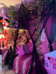 a bedroom decorated with pink and black decor