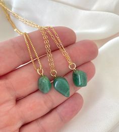 **Each piece in my shop, I personally create and photograph. (All photos are property of The Cord Gallery LLC) Thank you for supporting my small business.All Natural Aventurine Pendant NecklaceAdd a pop of green to your accessories with these pretty pendant necklaces! Features genuine Aventurine Gemstones, tumbled to a smooth, asymmetrical size and finish. Adorned on your choice of chain in the length of your choosing. Chain Options:Gold Filled Link ChainGold Filled Box ChainGold Filled Figaro C Aventurine Necklace With Natural Stones For Gift, Aventurine Pendant Crystal Necklace For Gift, Aventurine Pendant Crystal Necklace As Gift, Gift Aventurine Pendant Crystal Necklace, Aventurine Natural Stone Necklace For Gifting, Gold Aventurine Necklace As Gift, Gold Aventurine Necklace For Gift, Emerald Necklace With Natural Aventurine Stones As Gift, Green Aventurine Necklace