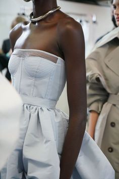 A strapless pale sky blue corset dress with a parachute skirt from the #McQueenSS22 collection. Photographed by Ruby Pluhar. Worn by Awar Odhiang. Blue Corset Dress, Alex Mcqueen, Parachute Skirt, Winter Gowns, Sky Blue Dress, Bridal Corset, Alexander Mcqueen Fashion, Blue Corset