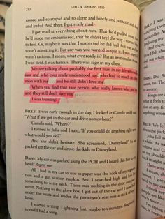 an open book with pink writing on the page and someone's hand holding it