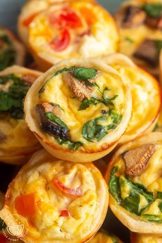 mini quiches filled with cheese, spinach and other veggie toppings