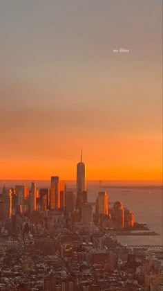 the sun is setting over new york city