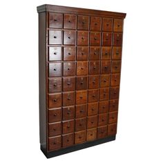 a large wooden cabinet with many drawers on it's sides and one door open