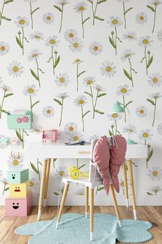 a child's room with flowers on the wall