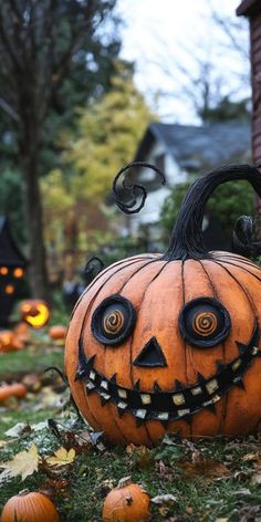 a pumpkin that is sitting in the grass