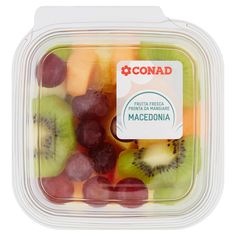 a plastic container filled with assorted cut up kiwis and grapes on top of each other