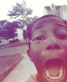 a young man with his mouth open in front of a building that says rio de janero