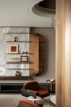 a living room filled with furniture next to a wall mounted shelf and two brown chairs