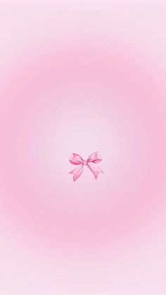 a pink wallpaper with a bow on the top and bottom corner in the middle