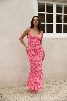 Capture unforgettable moments in our Majorca Memories Maxi Dress in Pink. Whether you're strolling through charming cobblestone streets or savoring sunset views along the coastline, this dress embodies the essence of romance and wanderlust, making every moment in Majorca a cherished memory.  Maxi dress, true to size  V neckline Tie shoulder straps  Low cowl back Adjustable back strap  Invisible side zip Flowy skirt Semi-lined 100% Rayon Non-stretch material Print placement may vary  Please refer to the care label on garment for specific instructions on how to care for it Model wears XS Length from shoulder to hem: 134cm on an S Chest 35cm, Waist 31cm, size S Hawaiian Dresses, White Slip Dress, Cobblestone Streets, Crop Top Tees, Hawaiian Dress, Majorca, Denim Shoes, Print Placement, Printed Jumpsuit