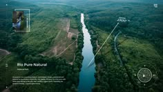 an aerial view of a river surrounded by trees