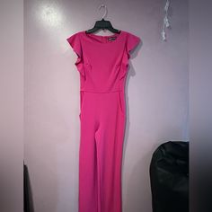 Brand New Pink Jumpsuit From Dillards, Perfect To Dress Up Or Down. Great For Pageant Interview, Deca, Fbla,Ect. Wide Leg, And Has 2 Pockets In The The Front. Cute Sleeve Detail. Black Fitted Jumpsuit, Lace Maxi Romper, Maternity Romper, Pageant Interview, Womens Black Jumpsuit, Fashion Nova Jumpsuit, Chambray Romper, Boho Jumpsuit, Maxi Romper