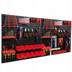 a wall mounted tool rack filled with lots of tools and wrench's on it