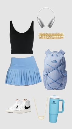 a women's outfit with headphones, backpack and other items