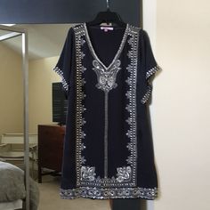 Never Worn Calypso St Barth Tunic In A Luxurious 100% Silk. Size Xs. The Silver Beading Is Superb And The Fit Is Gorgeous. Loose But Cut To Flatter The Figure. Perfect For That Resort Vacation. Elegant Short Sleeve Tunic For The Beach, Elegant Short Sleeve Beach Tunic, Fitted Short Sleeve Tunic For Beach, Elegant Black Summer Tunic, Fitted V-neck Tunic For Vacation, Black Sequin Beach Dress, Black Fitted Summer Tunic, Black Embellished Beach Dress, Bohemian Embroidered Tunic For Beach Cover-up