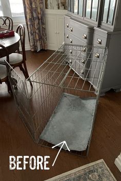 a dog cage that has been placed on the floor