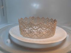 a tiara sitting on top of a white plate