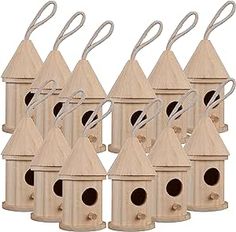 six wooden bird houses with one hanging off the side