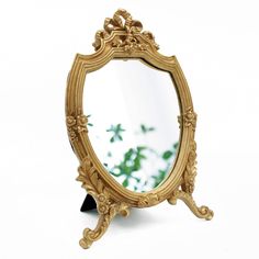 PRICES MAY VARY. Unique gold shield shape frame design，very decorative and functional，s an excellent choice for Baroque and any other antique decor Small hooks and brackets on the back for easy installation or place on the table. Suitable for living rooms, bedrooms, bathrooms, dining rooms and etc. A great decorative wall mirror or desktop mirror MADE of resin materials，SIZE:8.2W x 13 L No Distortion Mirror - High-quality glass mirror with no deformation, perfect for makeup. Each package include Dresser In Living Room, Desktop Mirror, Gold Shield, Decorative Wall Mirror, Mirror Wall Bedroom, Vintage Mirror Wall, Desk Mirror, Mirror Makeup, Resin Frame