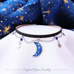 Hello, we have for you our new celestial galaxy chokers with cute crescent moon and stars! Available in 2 options: 1. 2,5cm, darker moon with gold stars and dark blue beads 2. 2cm, gradient moon, with light blue beads 3. you can choose other moon from picture if you'll need personalization, feel free to write to me! I can make other colors and I have more available moons, made on order too :) Choker is made of sparkling faux leather in dark grey color. All metal elements are made by surgical ste Space Themed Accessories, Moon Choker, Moon Fashion, Star Choker, Emo Jewelry, Moon Accessories, Space Jewelry, Layered Chokers, Moon Gifts