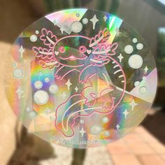 a sticker with an image of a cat in the center and stars around it