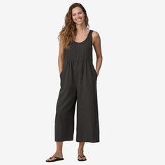 A cool-wearing jumpsuit for hot, humid conditions made of durable, breathable 55% hemp/45% TENCEL™ lyocell plain-weave fabric. Made in a Fair Trade Certified™ factory. | Patagonia Women's Garden Island Lightweight Jumpsuit in Ink Black, Medium - Outdoor Clothing - Hemp/Tencel Lyocell Linen Jumpsuit For The Beach, Casual Linen Jumpsuits And Rompers For Loungewear, Patagonia Pants, Boho Queen, Cute Pants, Blue Jumpsuits, Patagonia Womens, Woman Standing, Sleeveless Jumpsuits