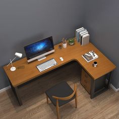 a computer desk with a monitor and keyboard on it, next to a small chair