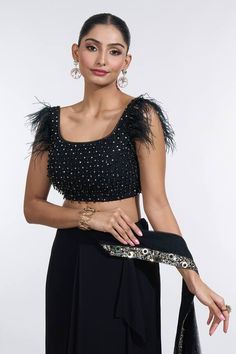 Black pre-draped skirt saree with confetti sequin embroidered palla border. Paired with a ostrich feather embellished short sleeves bead embellished blouse and a sequin embellished belt. - Aza Fashions Sarees Black, Skirt Saree, Net Embroidery, Embellished Shorts, Embellished Belt, Drape Saree, Embellished Blouse, Draped Skirt, Beaded Neckline