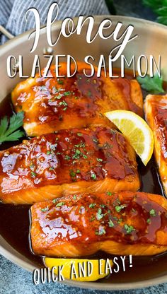 honey glazed salmon in a bowl with garnish and lemon