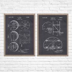 two framed drawings of basketball hoops on a brick wall