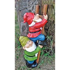 two gnomes are climbing up the side of a tree