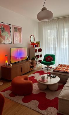 a living room filled with furniture and a flat screen tv