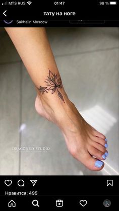 a person with a flower tattoo on their foot