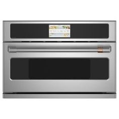 a stainless steel oven with the door open and an ad on it's side