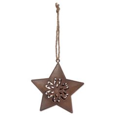 a metal star ornament hanging from a rope