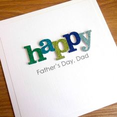 a father's day card with the word happy written in multicolored letters