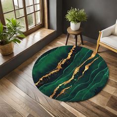 a round rug with green and gold paint on it in the middle of a living room