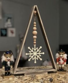 two nutcracker figurines sitting on top of a counter