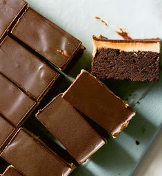 chocolate cake with peanut butter frosting and one slice cut out on a blue plate