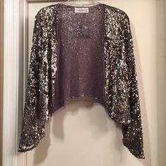 Silver/Bronze Sequin With Distressed Looking Cardigan From Abercrombie & Fitch. Lightweight. New With Tags. Size Medium. Glamorous Evening Winter Cardigan, Glamorous Evening Cardigan For Winter, Fitted Cardigan For Fall Party, Elegant Fall Party Shrug, Elegant Party Shrug For Fall, Elegant Fall Cardigan For Party, Fitted Holiday Cardigan For Party, Elegant Fall Party Cardigan, Elegant Sequined Cardigan For Fall