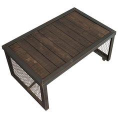 a wooden coffee table with metal mesh on top