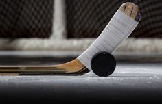 an ice hockey stick laying on the ground